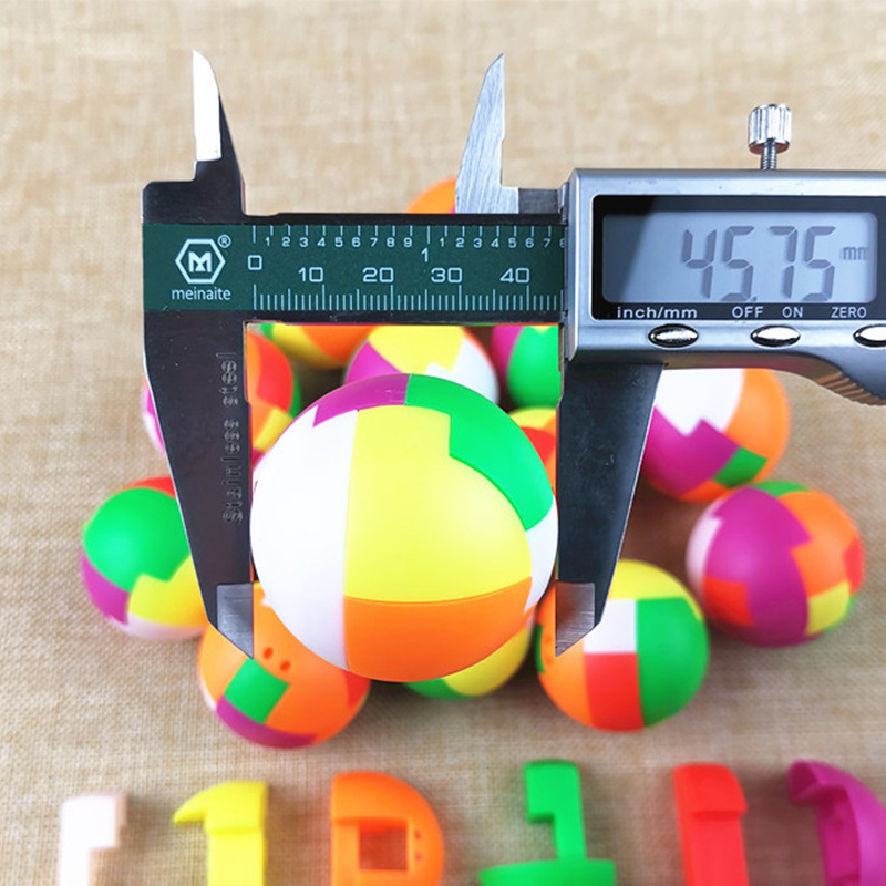 45 mm puzzelbal automaat spelm - Party Games Egg recensie en prijs